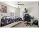 Bedroom with a gaming setup and ceiling fan at 1171 E Hopkins Dr, Elizabeth, CO 80107