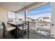 Covered patio with seating area and view of neighborhood at 1171 E Hopkins Dr, Elizabeth, CO 80107