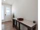 Bright entryway with a marble-top console table and hardwood floors at 1171 E Hopkins Dr, Elizabeth, CO 80107