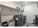 Laundry room with washer, dryer and shelving at 1171 E Hopkins Dr, Elizabeth, CO 80107