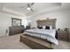 Main bedroom with a large bed and plenty of light at 1171 E Hopkins Dr, Elizabeth, CO 80107