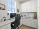 Home office with built-in cabinetry and plenty of workspace at 1171 E Hopkins Dr, Elizabeth, CO 80107