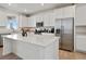 Bright kitchen featuring stainless steel appliances and a large island at 1171 E Hopkins Dr, Elizabeth, CO 80107