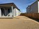 Exterior view of the home featuring a fenced backyard and well-maintained grassy area at 8945 Rifle St, Commerce City, CO 80022