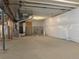 Unfinished basement featuring concrete floors and insulated walls, offering potential for customization and expansion at 8945 Rifle St, Commerce City, CO 80022