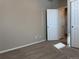 A carpeted bedroom features neutral walls and a closet with an open door at 8945 Rifle St, Commerce City, CO 80022