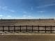 Scenic view overlooking vast open space with a wooden fence in the foreground at 8945 Rifle St, Commerce City, CO 80022