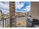 Outdoor balcony featuring a grill and neighborhood views at 2225 Santini Trl # A, Littleton, CO 80129