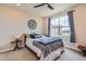Comfortable bedroom with large window, ceiling fan and stylish decor at 2225 Santini Trl # A, Littleton, CO 80129