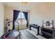 Versatile room with exercise equipment and natural light, perfect for a home gym or studio at 2225 Santini Trl # A, Littleton, CO 80129