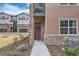 Close up view of the front entrance with manicured landscape and decorative wreath at 2225 Santini Trl # A, Littleton, CO 80129
