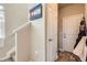 Inviting entryway featuring hardwood floors, staircase and a welcoming colorado themed wall decor at 2225 Santini Trl # A, Littleton, CO 80129