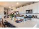 Bright and open kitchen with stainless appliances, kitchen island and pendant lighting at 2225 Santini Trl # A, Littleton, CO 80129
