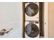 Efficient laundry area equipped with a modern, stacked washer and dryer at 2225 Santini Trl # A, Littleton, CO 80129