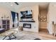 Bright and airy living room featuring a modern electric fireplace and stylish decor at 2225 Santini Trl # A, Littleton, CO 80129