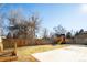 Large backyard with playset, garden, and concrete patio at 3050 S Ash St, Denver, CO 80222