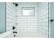 White subway tile shower with built-in shelves at 3050 S Ash St, Denver, CO 80222