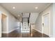 Elegant staircase with dark hardwood floors and white railings at 3050 S Ash St, Denver, CO 80222