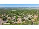 Aerial view showcasing the neighborhood with lush greenery and mountain views at 2587 S Harlan Ct, Lakewood, CO 80227