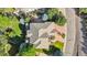 Aerial roof view of a home, with surrounding garden, patio, and driveway at 2587 S Harlan Ct, Lakewood, CO 80227