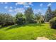 Lush backyard with a vibrant green lawn and a volleyball net at 2587 S Harlan Ct, Lakewood, CO 80227