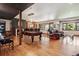 Spacious finished basement with a pool table, bar, fireplace, and comfortable seating area at 2587 S Harlan Ct, Lakewood, CO 80227