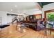 Large finished basement with bar, seating area, and staircase to upper level at 2587 S Harlan Ct, Lakewood, CO 80227