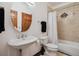 Cozy bathroom featuring tiled shower and pedestal sink at 2587 S Harlan Ct, Lakewood, CO 80227