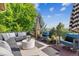 Inviting outdoor deck with comfortable seating, a modern umbrella, and a scenic view at 2587 S Harlan Ct, Lakewood, CO 80227