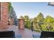 Outdoor deck area with decorative black railing and views of lush greenery at 2587 S Harlan Ct, Lakewood, CO 80227