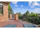 Spacious deck with a view, featuring wood flooring and metal railings at 2587 S Harlan Ct, Lakewood, CO 80227