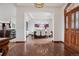 Inviting entryway showcasing hardwood floors, open access to the dining room, and elegant architectural details at 2587 S Harlan Ct, Lakewood, CO 80227