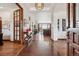 Elegant foyer with tile and hardwood floors, decorative lighting, and an open view to living areas at 2587 S Harlan Ct, Lakewood, CO 80227