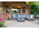 Relaxing outdoor patio area with a comfortable seating arrangement and brickwork at 2587 S Harlan Ct, Lakewood, CO 80227