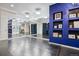 Bright studio space with mirrored wall, recessed lighting, and dark flooring at 2587 S Harlan Ct, Lakewood, CO 80227