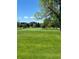 Expansive view of the well-manicured golf course, boasting lush green fairways and mature trees at 3144 S Wheeling Way # 401, Aurora, CO 80014
