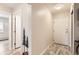 Inviting hallway featuring wood-look floors, neutral walls, and modern lighting, providing a welcoming entrance to the home at 3144 S Wheeling Way # 401, Aurora, CO 80014