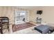 Comfortable living room with light wood-look floors and balcony access providing a relaxing space to unwind at 3144 S Wheeling Way # 401, Aurora, CO 80014