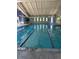 Bright indoor lap pool with multiple lanes, high ceilings, and tile accents, perfect for recreation at 3144 S Wheeling Way # 401, Aurora, CO 80014