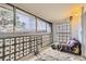 Relaxing sunroom with large windows, unique block privacy screen, and warm lighting at 3144 S Wheeling Way # 401, Aurora, CO 80014