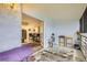 Open sunroom with view to interior living and kitchen with a sliding glass door at 3144 S Wheeling Way # 401, Aurora, CO 80014