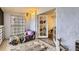 Cozy sunroom showcasing textured walls, a unique glass block window, and an inviting space for relaxation at 3144 S Wheeling Way # 401, Aurora, CO 80014