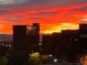 Breathtaking view of a vibrant and fiery sunset over the city skyline, creating a stunning natural panorama at 3144 S Wheeling Way # 401, Aurora, CO 80014