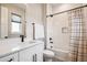 Modern bathroom with a white vanity, black fixtures, and a shower-tub combination with tiled walls at 3550 Uinta St # 6, Denver, CO 80238