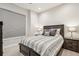 Well-lit bedroom featuring a wooden bed frame, neutral color palette, and a cozy atmosphere at 3550 Uinta St # 6, Denver, CO 80238