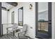 Cozy covered deck featuring two chairs and a scenic view at 3550 Uinta St # 6, Denver, CO 80238