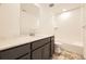 Bathroom featuring a vanity with a single sink, modern fixtures, and a tiled shower-tub combo at 2190 S Haleyville Way, Aurora, CO 80018