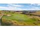 Scenic golf course with manicured greens and sand traps in a residential community at 8075 S Vandriver Way, Aurora, CO 80016