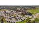 Aerial view of the community clubhouse and amenities, including the pool and tennis courts at 8075 S Vandriver Way, Aurora, CO 80016
