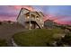 Beautiful backyard featuring a raised deck, patio area, and lush green lawn at 8075 S Vandriver Way, Aurora, CO 80016
